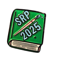 Enamel pin of a green book with a paintbrush on it with the text, "SRP 2025."
