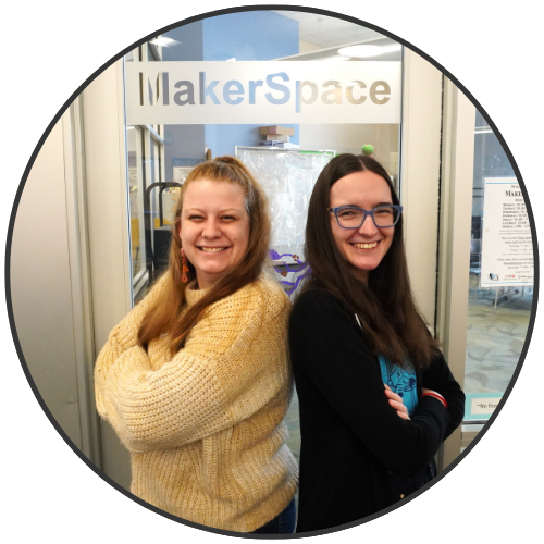 Jenna and Mary Ann standing in front of the MakerSpace door.