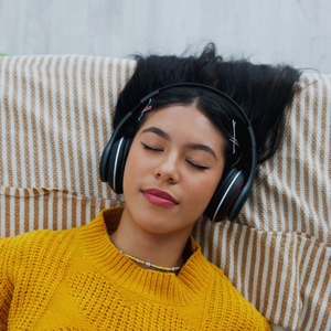 Woman listening to audiobooks on headphones