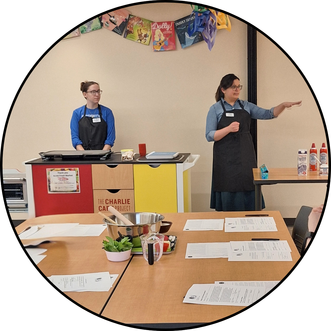 Librarians in front of the charlie cart mobile kitchen