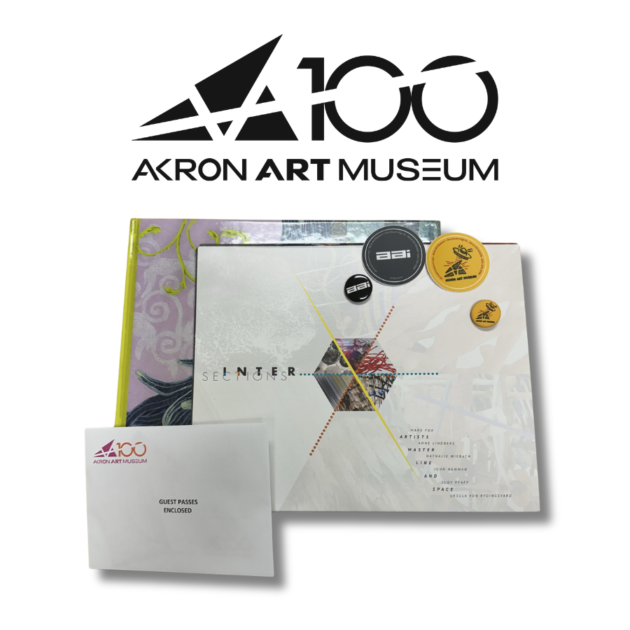 Akron Art Museum logo and two wrapped books plus an envelope that says guest passes