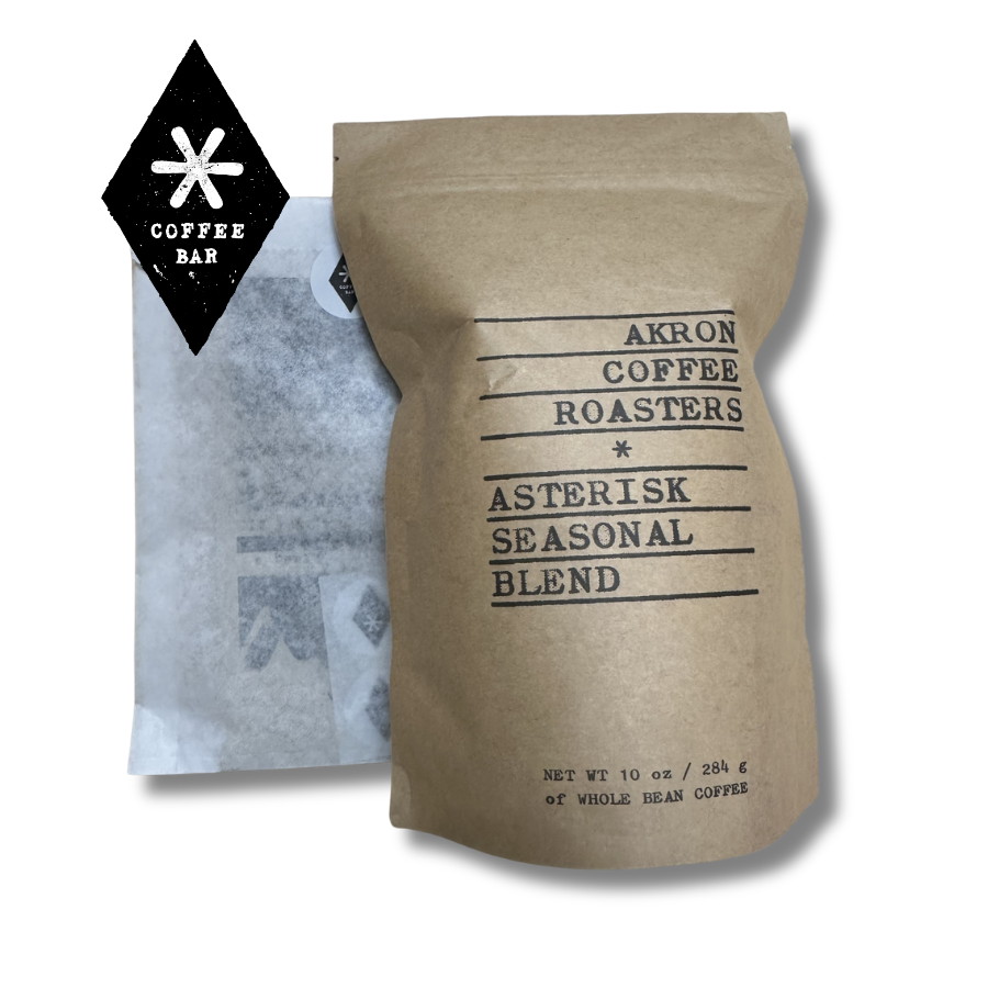 Asterisk coffee logo, a bag of coffee beans, and a bag with a gift card inside of it
