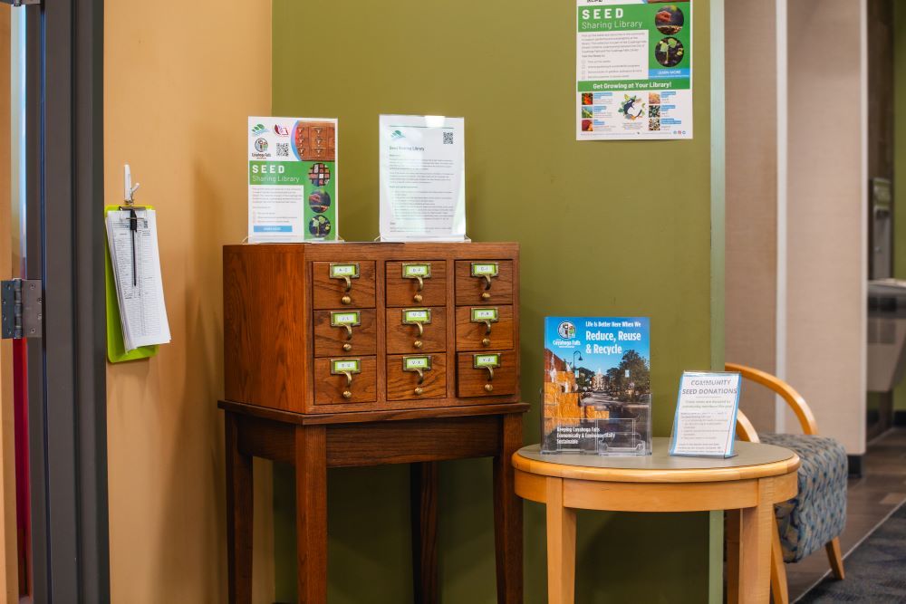 Card catalog and small table with flyers about the Seed Sharing Library
